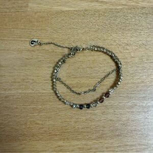 Gold tone double chain bracelet with colorful clear beads